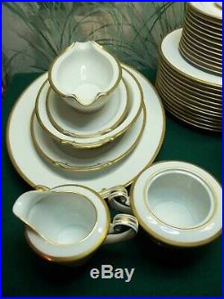 79 PIECE SET OF NORITAKE CHINA WHITE WithGOLD TRIM HAS M IN A WREATH LOGO